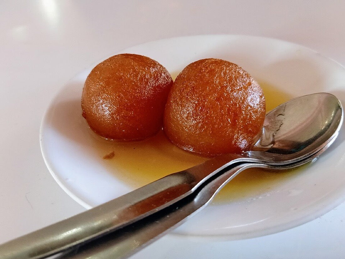 Two gulab jamun in syrup